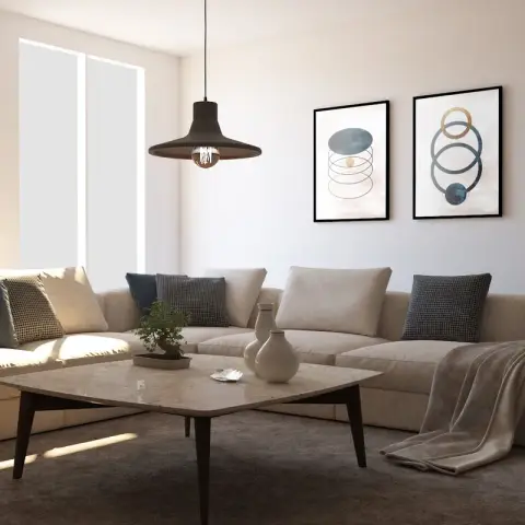 Living room with a large beige L-shaped sectional sofa, a square marble-top coffee table on angled wood legs, and a pair of framed abstract prints above.