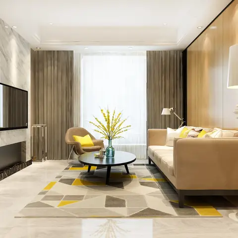 Living room with a polished marble-clad TV wall and a wood-panelled accent wall flanking a beige sofa on a grey-and-yellow geometric rug.