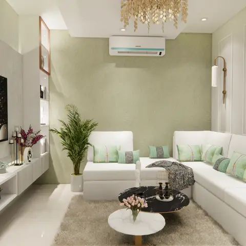 Living room with a sage textured accent wall, white L-shaped sectional sofa styled with mint cushions, a fluted TV console, and a gold leaf-cluster chandelier.
