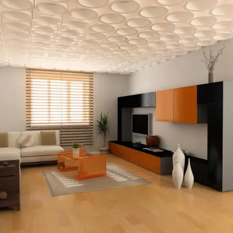 Living room with a scalloped dimpled false ceiling above an orange-and-black lacquer TV wall unit and an acrylic orange coffee table.