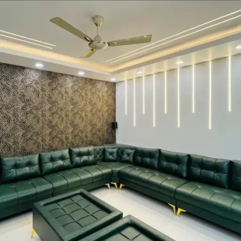 Living room with a swirl-patterned bronze-and-black wallpaper feature wall, vertical hanging LED light strips