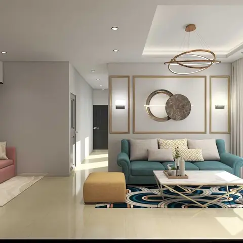 Living room with a teal and blush sofa pairing beneath a gold-framed circular wall art panel and a ring-style pendant light.