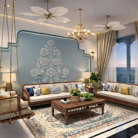 Living room with a teal Mughal floral-motif accent wall, a hanging cane swing, twin carved-wood cane sofas, and arched glass doors opening to a sea view.