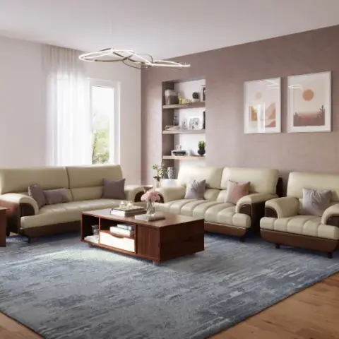 Living room with a textured mauve accent wall hung with a pair of framed prints, cream leather sofas around a wood coffee table on a blue abstract rug