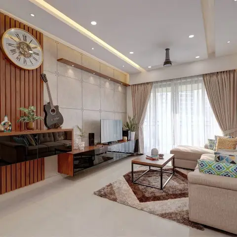 Living room with a textured stone-panel feature wall holding a large clock and wall-mounted guitar above a floating wood TV console.