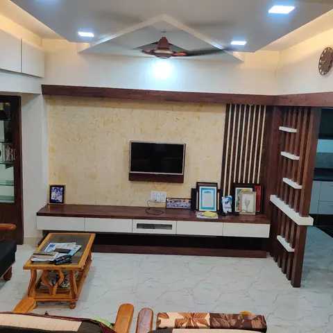 Living room with a textured stone-effect TV feature wall, a floating wood-and-white TV console