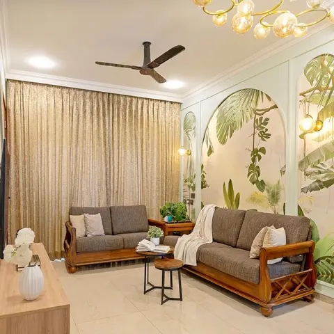 Living room with a tropical botanical wallpaper mural set in arched wall panels, a bubble-cluster gold chandelier, gold curtains