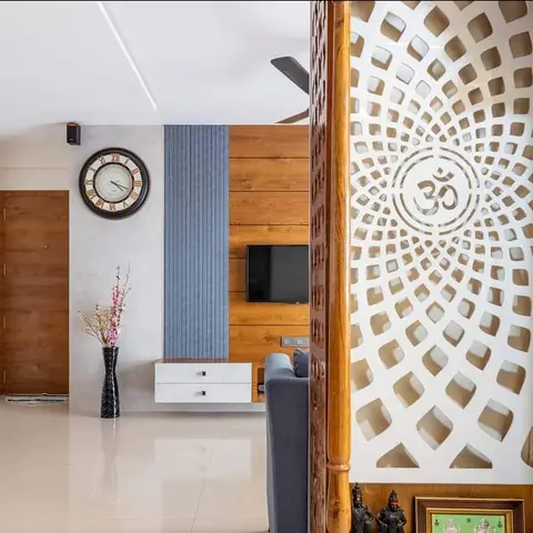 Living room with a wall-mounted TV on a wood-panelled and fluted grey feature wall, a floating white console below
