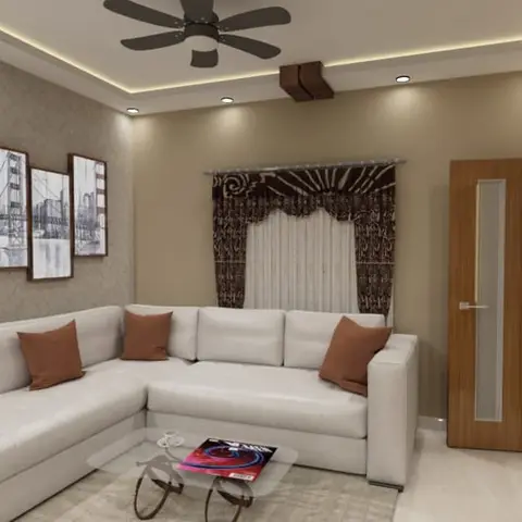 Living room with a white sectional sofa with rust cushions, a gallery wall of framed city photographs, and a cove-lit POP ceiling with a wood beam accent.