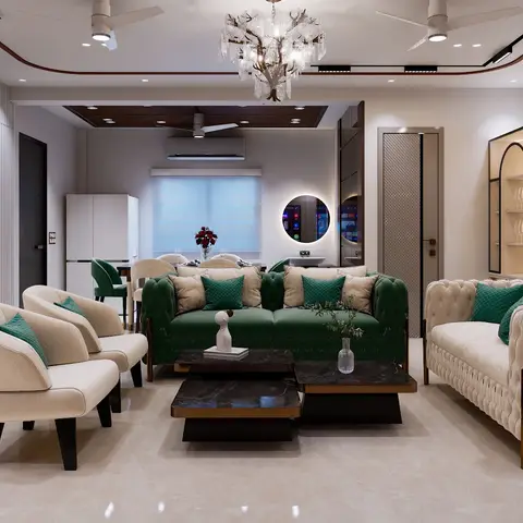 Living room with an emerald-green tufted chesterfield sofa and cream armchairs around nested black marble coffee tables, under a crystal branch chandelier.