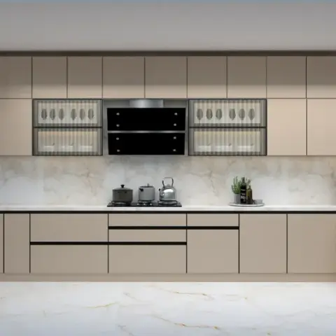 Long beige matt handleless kitchen shot straight on, with fluted-glass wall cabinets flanking a black chimney, a calacatta slab dado and floor