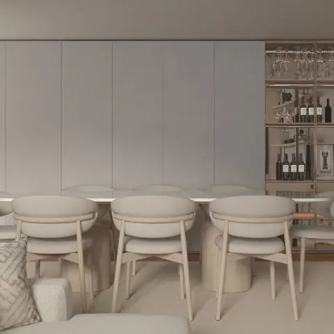 Long dining table with curved boucle-upholstered chairs beside an open bar shelving unit on brass rods, backed by a bookmatched marble wall.