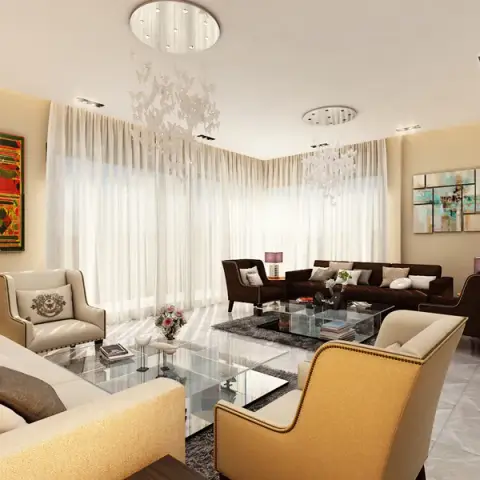 Long living room render with two seating groups - cream sofas and gold nailhead armchairs at the front