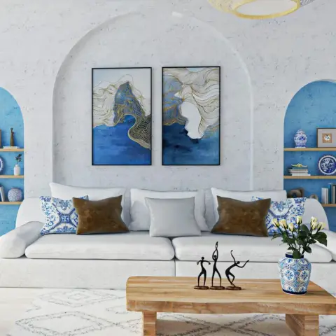 Low white slab sofa under a blue-and-gold diptych in a plastered arched recess, flanked by two smaller arched niches painted bright blue and shelved