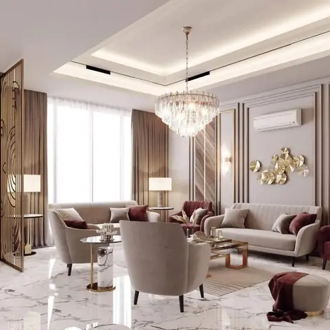 Marble-floored living room with a tiered crystal chandelier, taupe channel-tufted sofas, burgundy velvet accents