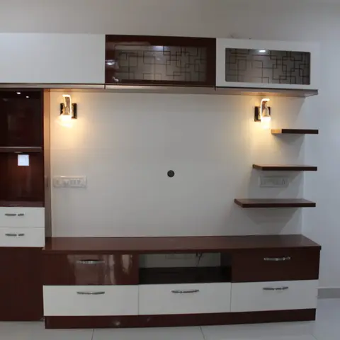 Maroon and white gloss TV unit wall with laser-cut glass upper cabinets, sconce lighting, and a floating shelf ladder, TV not yet installed.
