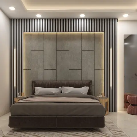 Master bedroom with a backlit vertical-slat feature wall framing a stone-panel headboard, matching zigzag-inlay wardrobe, and rust bouclé pouf stools.