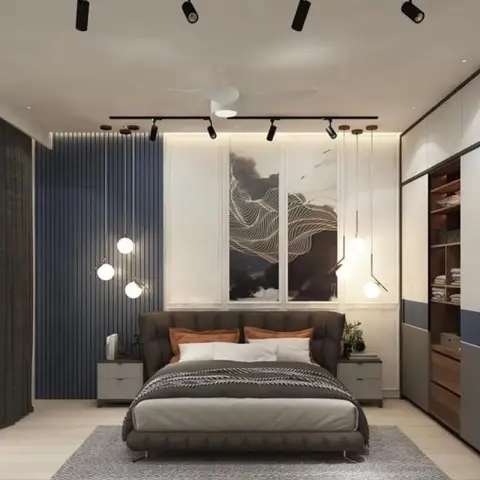 Master bedroom with a fluted slate-blue accent wall behind a tufted bed, framed abstract art, cluster pendant lighting and a two-tone built-in wardrobe.