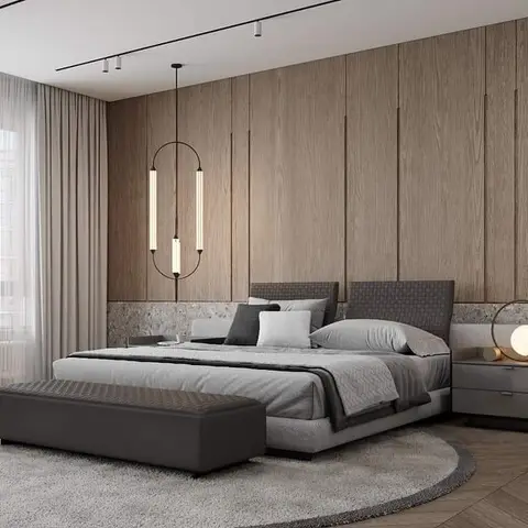 Master bedroom with a full-height vertical wood slat panelled wall on a stone dado, a grey upholstered bed with a round shag rug