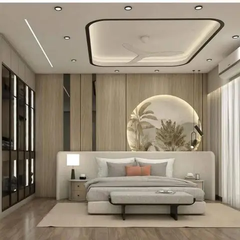 Master bedroom with a geometric cove-lit false ceiling, a wood-panelled headboard wall with a backlit circular botanical artwork, and a glass-front wardrobe.