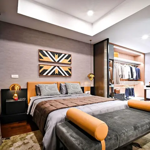 Master bedroom with a mustard leather headboard, twin geometric wall art panels, a gold pendant light, and an open walk-in wardrobe beyond