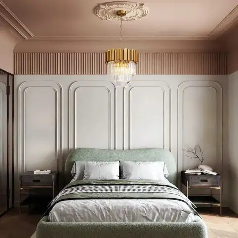Master bedroom with a sage green upholstered bed, arched panel moulding walls in blush and white, and a brass-and-crystal pendant chandelier