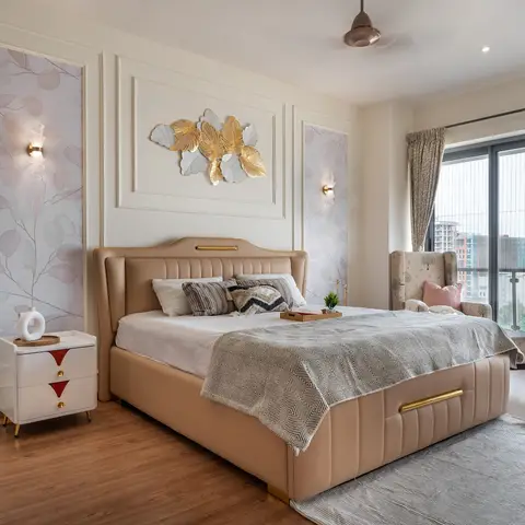 Master bedroom with a tufted beige leather bed, gold leaf wall art, moulded wall panels with botanical wallpaper inserts