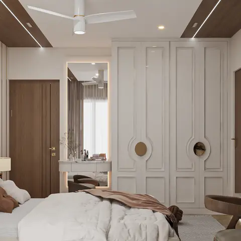 Master bedroom with a tufted upholstered bed, a paneled off-white wardrobe with brass circular mirror inlays, a mirrored dressing nook