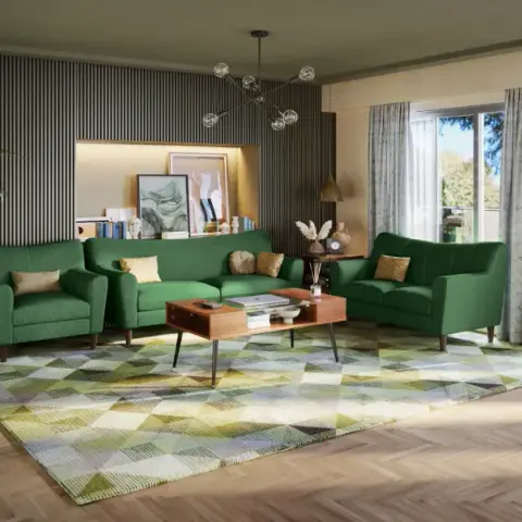 Mid-century living room with an emerald green sofa set, a fluted charcoal panel display niche, a sputnik chandelier, and a geometric multicolor rug.