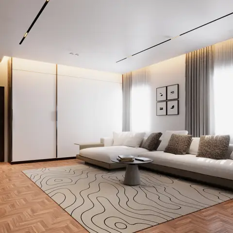 Minimalist living room with herringbone parquet flooring, a topographic-line patterned rug, a cream sectional with a round concrete-base coffee table