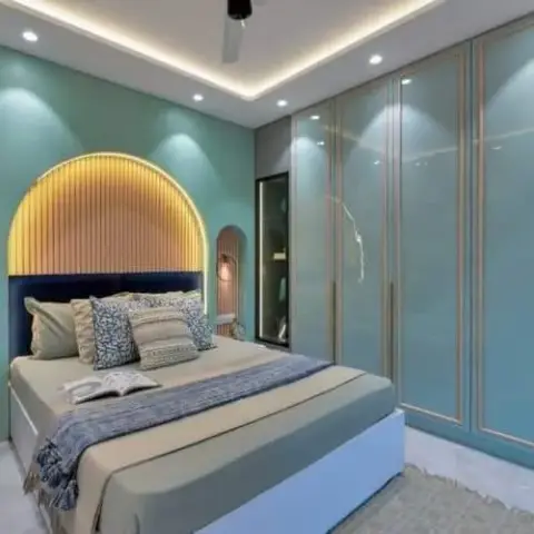 Mint-green bedroom render where a backlit arched fluted-wood niche frames a navy upholstered headboard, flanked by two smaller arched fluted alcoves