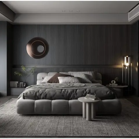 Moody dark bedroom render with fluted grey wall panelling behind the bed, a round mirror, a channel-tufted bench, and a leather lounge chair.