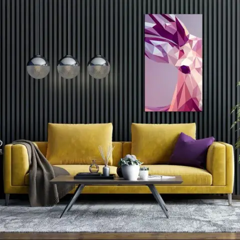 Mustard velvet three-seater against a black floor-to-ceiling slat wall, three smoked-glass globe pendants dropping at the left and a low-poly pink stag canvas