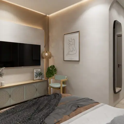 Narrow bedroom with a backlit ivory TV panel above a sage-green cane-fronted console