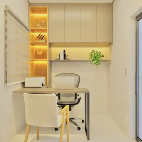 Narrow home-study niche with a backlit vertical shelf column of four lit cubbies beside overhead cabinets, a slim beige desk carrying a printer and laptop
