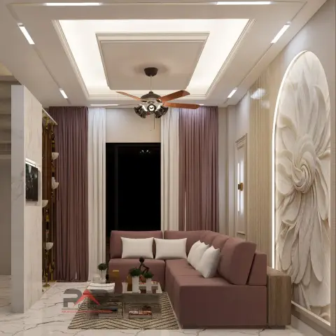 Narrow living room where a dusty-rose L-shaped sofa faces a backlit arched niche carved with an oversized flower relief