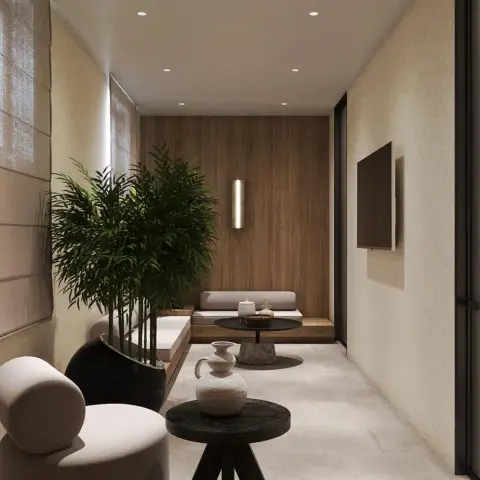 Narrow lounge where a low built-in platform sofa sits against a walnut-panelled end wall under a slim brass sconce