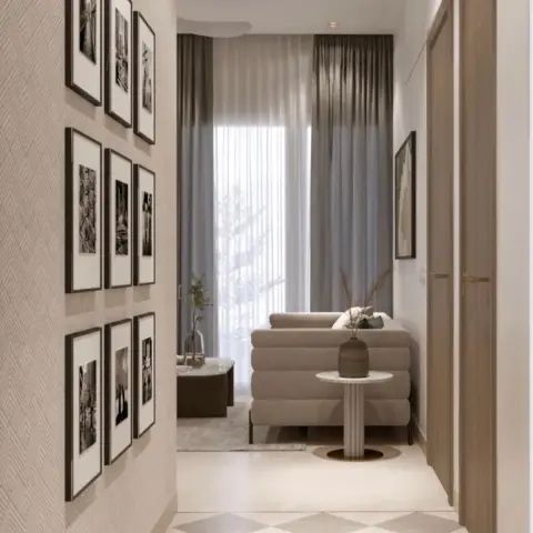 Nine black-and-white photographs hung in a 3x3 grid on herringbone-textured wallpaper