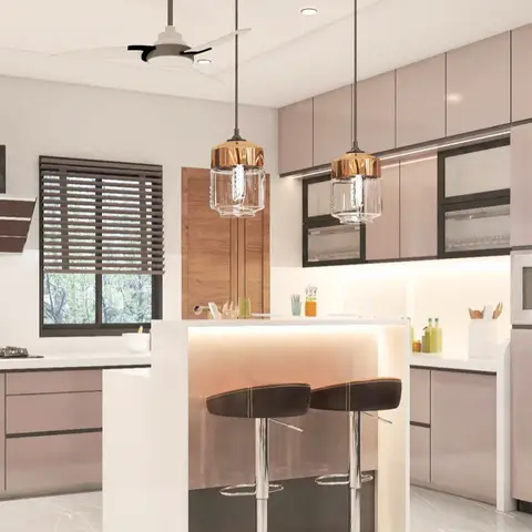Open kitchen with blush glossy cabinetry, a waterfall-edge breakfast island under twin amber pendant lights
