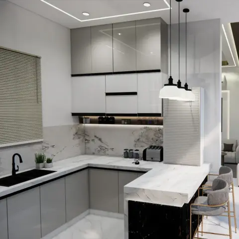 Open L-shaped kitchen with a black fluted-front breakfast counter, white marble waterfall countertop and backsplash, handleless grey-and-white gloss cabinets