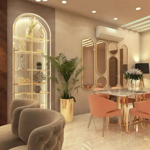 Open living-and-dining render in blush and gold, with a backlit arched niche of gold display shelves