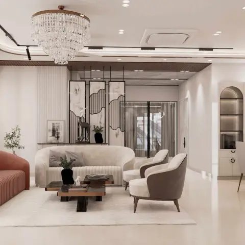 Open living and dining space with a terracotta curved sofa, a crystal tiered chandelier, a marble-panel screen divider