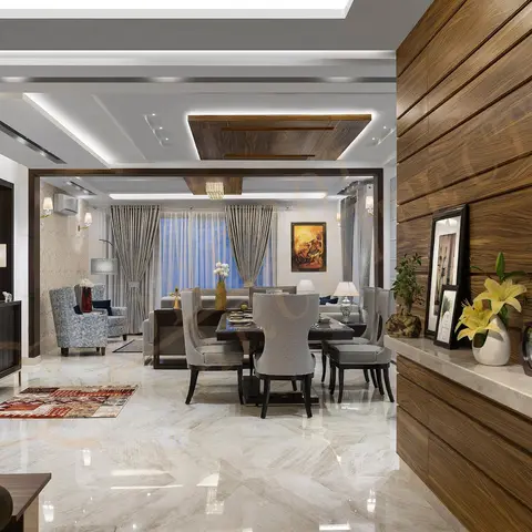 Open-plan dining and living area on book-matched marble flooring, with a wood-panelled display wall and console at the entry