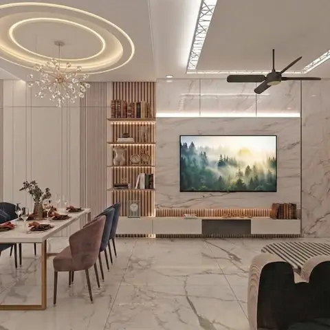 Open-plan dining and living area with a book-matched marble TV feature wall, fluted wood panelling