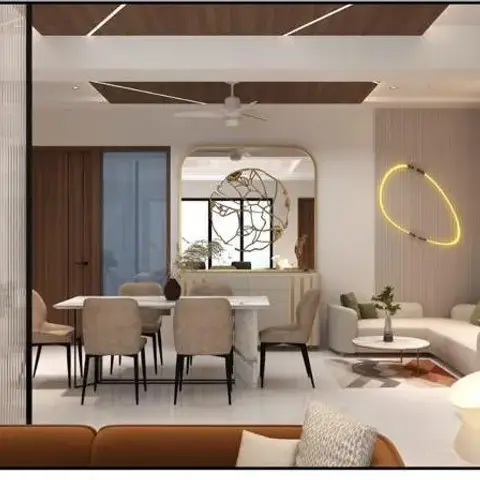 Open-plan dining and living area with a marble-top dining table, a round mirror paired with sculptural wall art, a glowing circular LED wall light