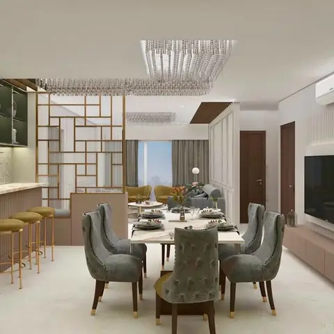 Open-plan dining and living space with a brass fretwork partition, a linear crystal chandelier over a dining table, and a blush wet bar with stools.