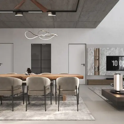 Open-plan dining and living space with a wood dining table under a sculptural wire pendant light, an exposed concrete ceiling with linear lighting and a fan