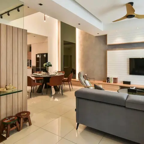 Open-plan home showing an entrance console with a decorative sculpture, a round dining table with leather chairs, a kitchen beyond