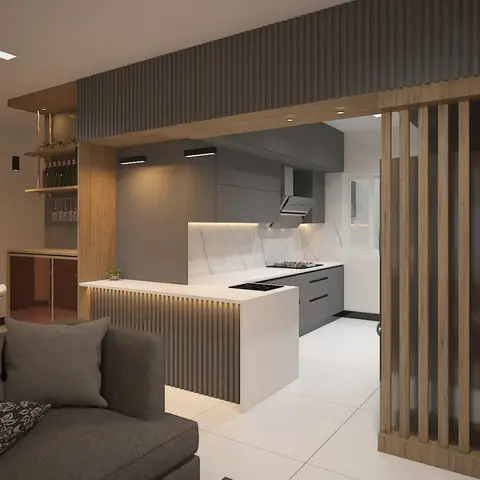 Open-plan kitchen island in white stone counter behind a fluted wood-and-grey partition