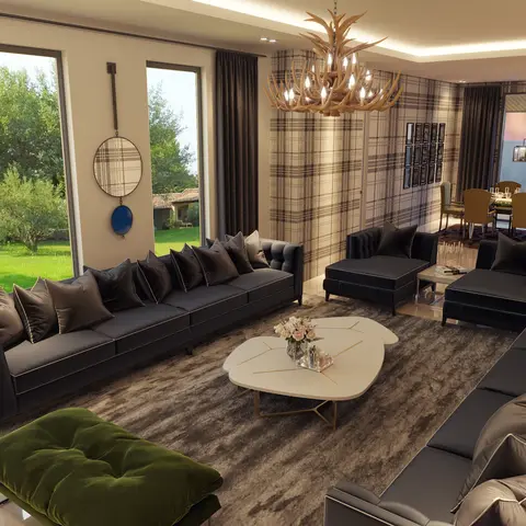Open-plan living and dining space with a rustic antler chandelier, charcoal velvet sofas facing an organic-shaped marble coffee table